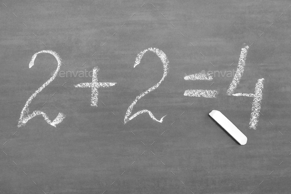 A simple mathematical task written on a gray chalkboard with white chalk