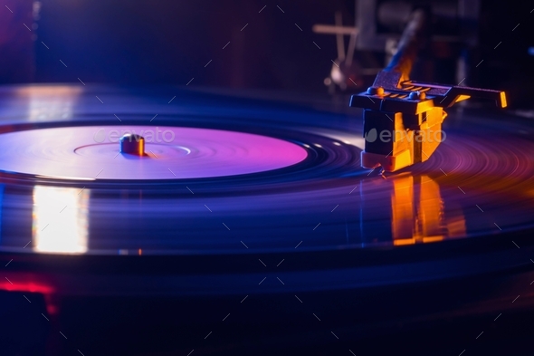 Retro-styled film look of a spinning record vinyl player