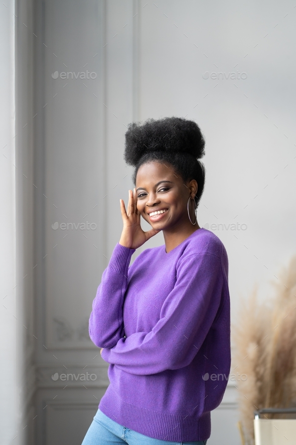 Smiling African American Millennial Woman With Afro Hairstyle Looking