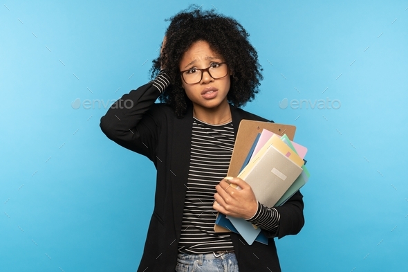 Afro woman student holding folder paper notebooks, forgot to learn a lecture, not prepared for exams