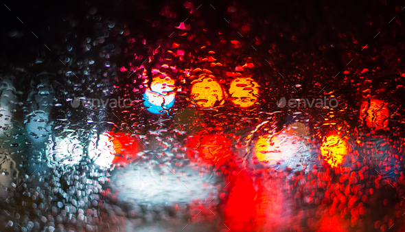 Abstract car lights from a rainy car window  - Stock Photo - Images