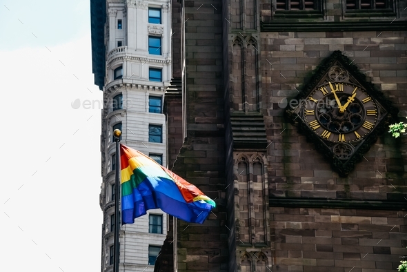 Rainbow flag in Trinity Church in Financial district of New York during Pride Parade event.