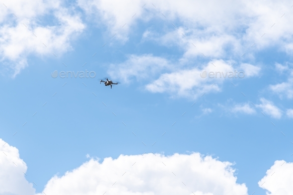 DJI Quadcopter Drone Mavic Mini flying against sky