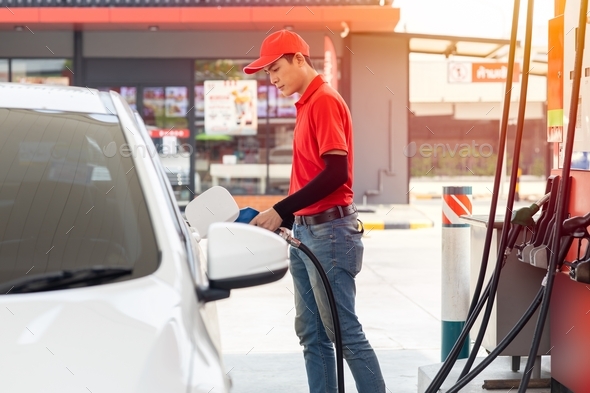 Gas station male man worker staff happy service working refill car gasoline fuel to traveller cars