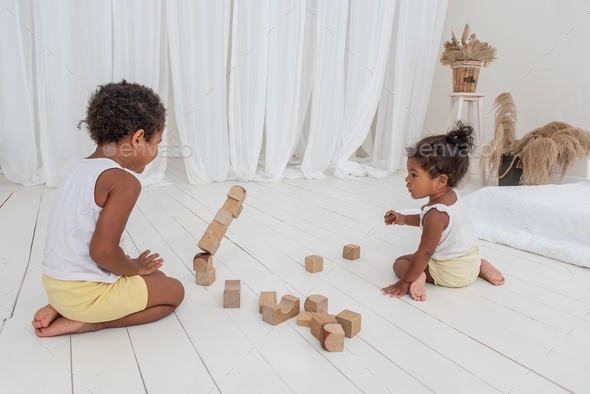 Little Brother and Sister African American play houses with wood