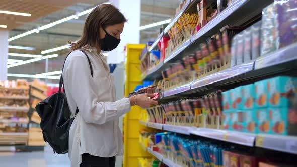 Buying Sweets and Chocolate in the Grocery alt