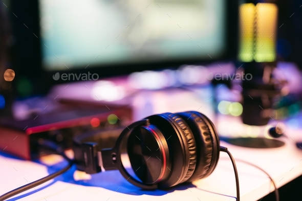 Modern creative sound studio background with headphones and neon lights ...