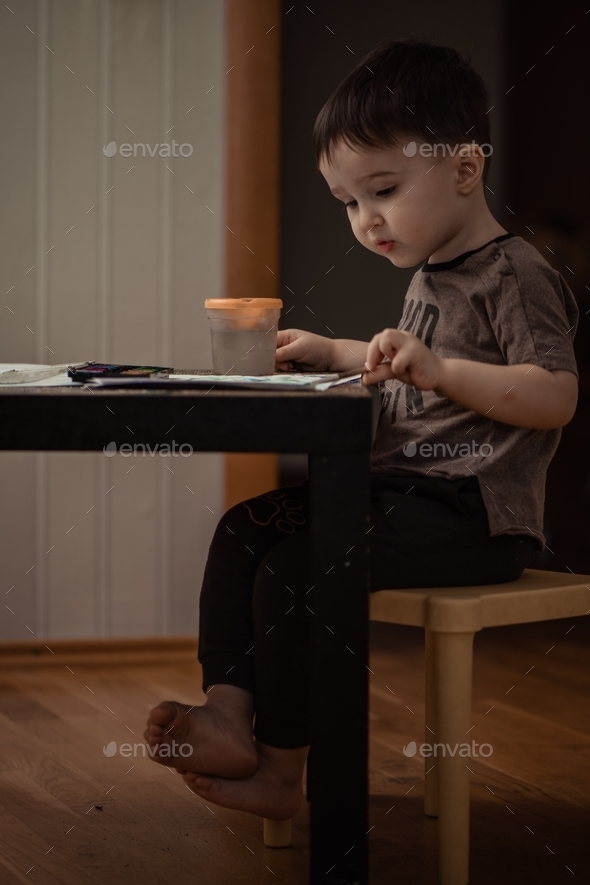 The kid draws with paints. Drawing with paints. Painting - Stock Photo - Images