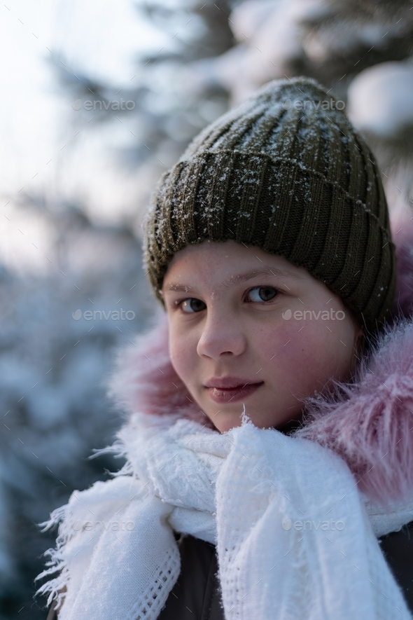Porter of a young girl walking on a winter day. - Stock Photo - Images