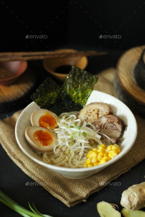 Miso ramen soup on the table with products and sauces for cooking Japanese cultural food