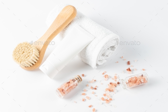 Set of home SPA cosmetic products. Dry Brush, Sea Salt, Scrub, and Towel. Anti-cellulite brush