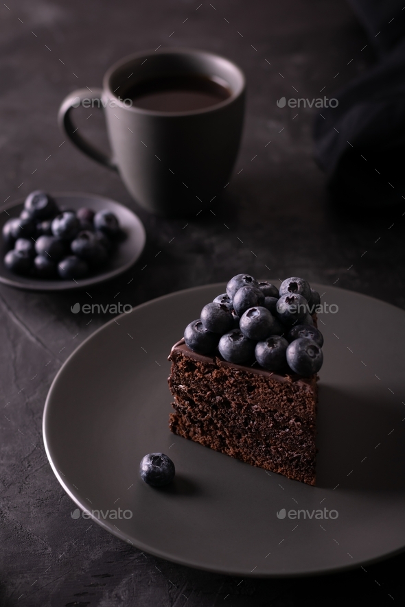 A piece of Prague cake with chocolate and berries