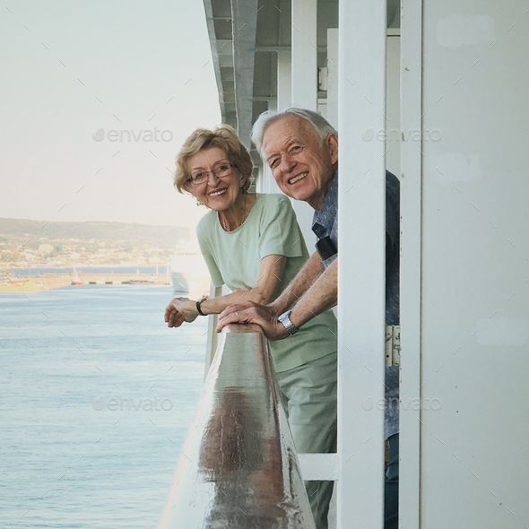 Happy smiling elderly couple on a cruise ship - Stock Photo - Images