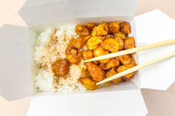 Orange chicken in takeout box - Stock Photo - Images