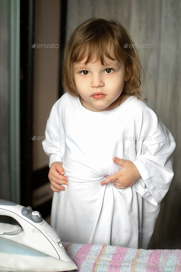little girl trying to iron clothes Stock Photo by olgar23 PhotoDune