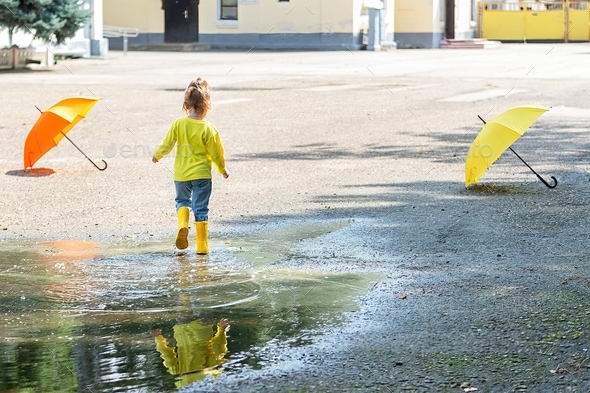 children on an active walk after the rain on a warm day