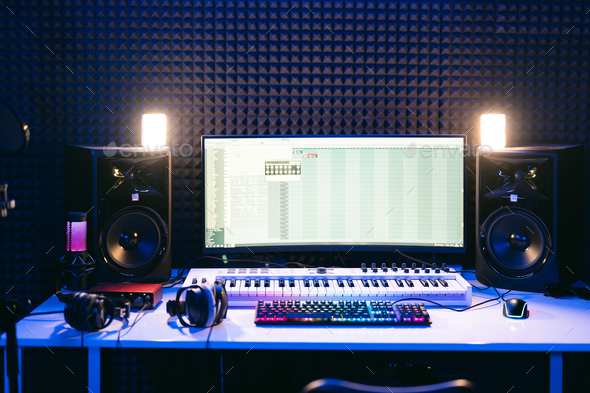Control panel of a modern music recording studio with a computer screen  Stock Photo by diignat