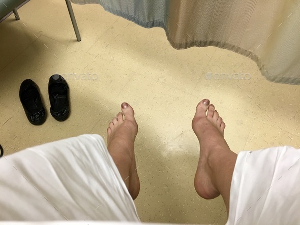 Looking down at my feet in doctors office waiting for gynecologist