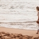 Mother and daughter walking on a sandy beach #debb_a/motherhood, #debb_a/childhood - PhotoDune Item for Sale