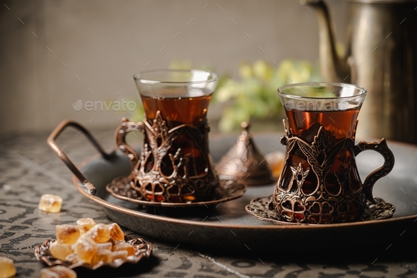 Turkish tea in traditional glass closeup on tile background Stock Photo