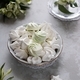 Marshmallows on a platter next to white flowers. View from above. - PhotoDune Item for Sale