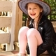 A little girl is sitting on the porch in a cowboy hat - PhotoDune Item for Sale