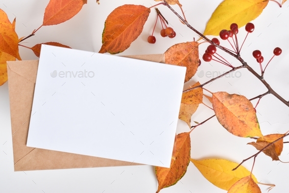 Postcard template on a beige background with an autumn branch of an apple tree.