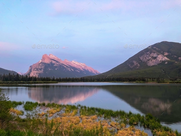 Sunset At vermillion lakes with beautiful reflections of the mountains in the lake - Stock Photo - Images