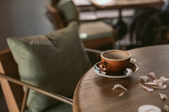 Coffee mug on the table. Beautiful wooden furniture. Copy space. - Stock Photo - Images