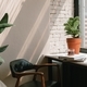 Office interior. Cup of coffee, books, chair, potted plants near window. Shadows on the wall. - PhotoDune Item for Sale
