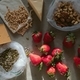 Fresh strawberries, cheese and butternut in eco bags on table in the kitchen. - PhotoDune Item for Sale