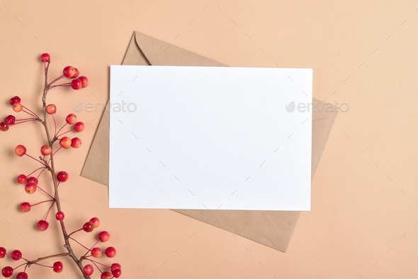 Postcard template on a beige background with an autumn branch of an apple tree.