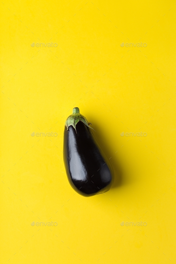 Eggplant or aubergine on yellow background, healthy eating concept - Stock Photo - Images