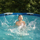 A boy swims in the pool on a hot day - PhotoDune Item for Sale