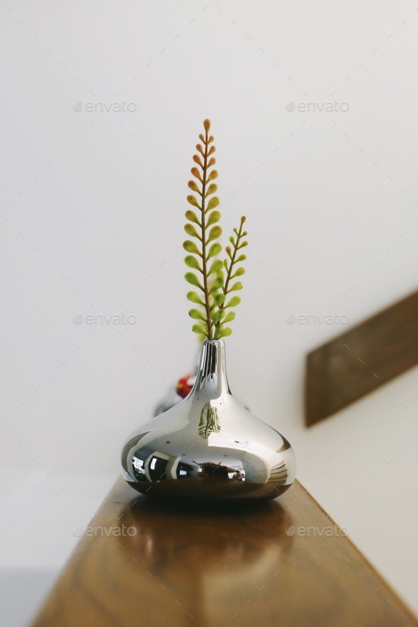 Fern tree in metallic vase