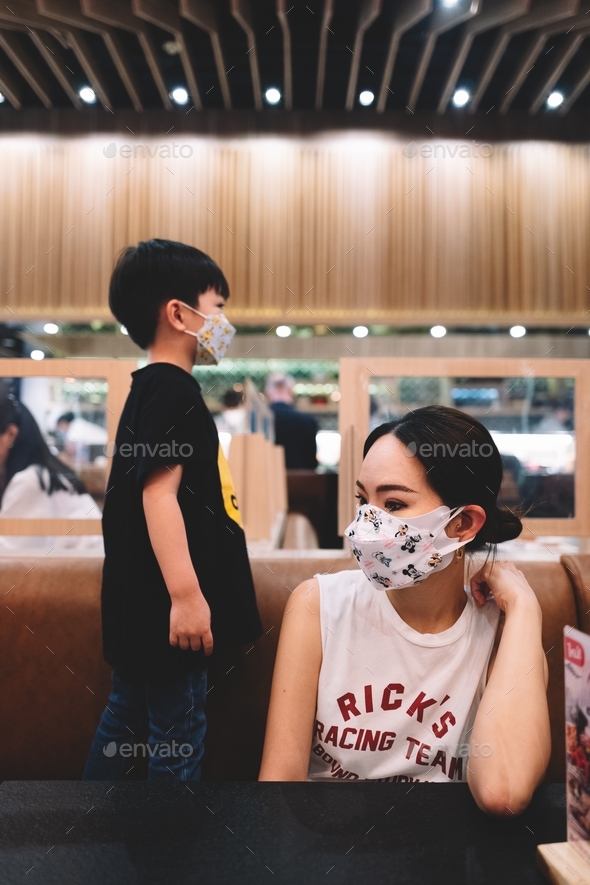 Mom and son in restaurant waiting for food