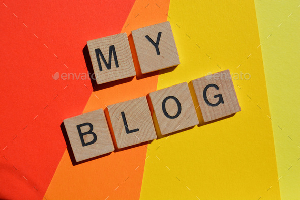 My Blog, words in 3D wooden alphabet, isolated on colourful background.