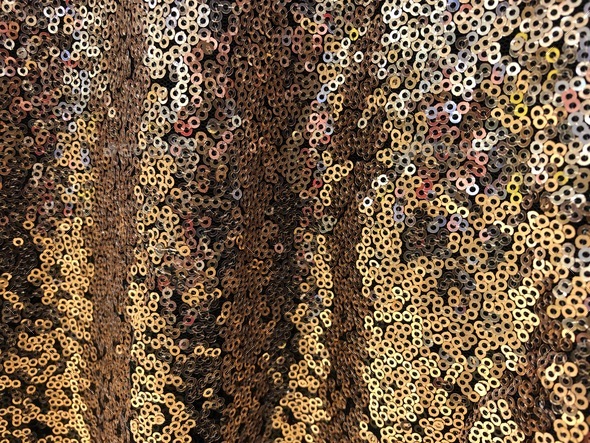 Gold sequin fabric, beautiful shiny abstract background wallpaper Stock