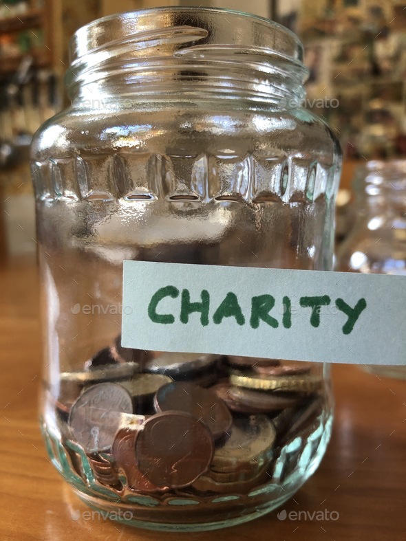 Collecting for charity, loose change in a glass jar