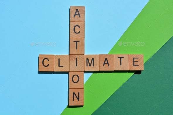 Climate Action, words in wood alphabet letters in crossword form isolated on green blue background
