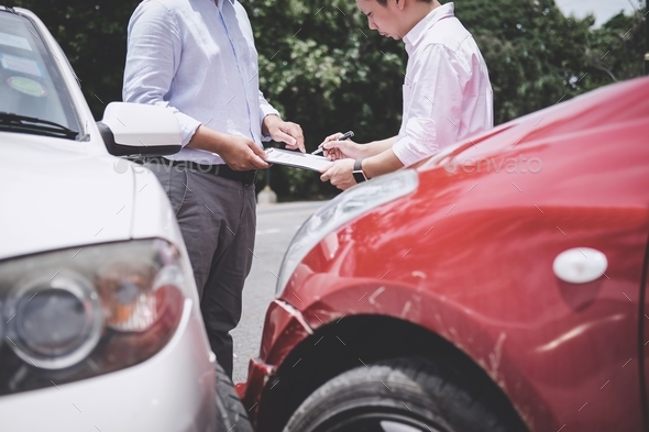 Insurance Agent examine Damaged Car and customer filing signature on 