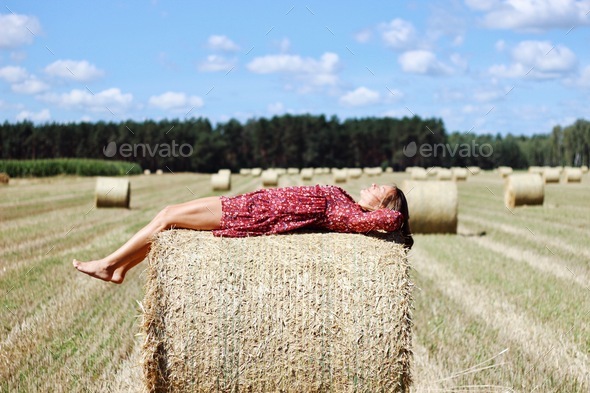 Bales of hay,women, summertime, summer style, take a breath, relax, chill, outdoors, countryside.
