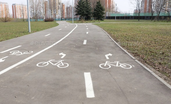 Bicycle path in the Park of big city.  - Stock Photo - Images
