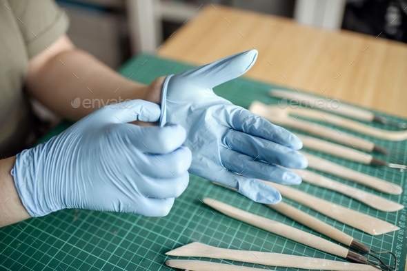 young artist hands in the process of creating a masterpiece of white  polymer clay on white, art concept Stock Photo