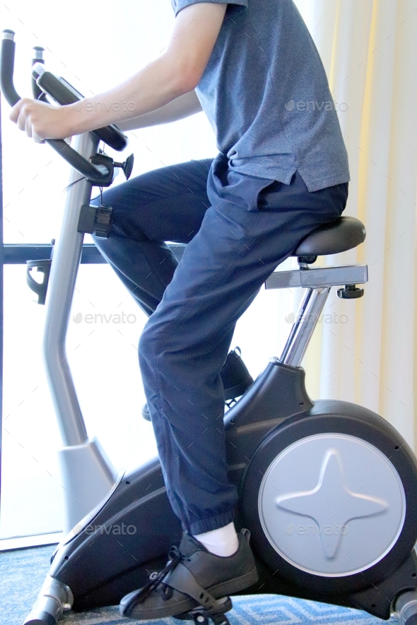 Teenage boy using an indoor exercise bike