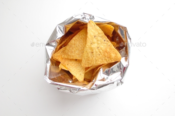Corn chips in their foil bag on a white background