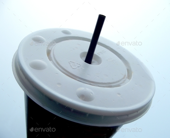 Plastic disposable soda cup and straw