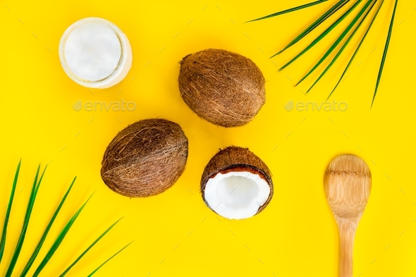 top view organic bio coconut butter with two whole fresh coconuts. oil for cooking and skincare