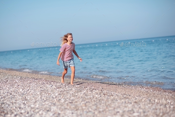 Girl running on the beach Stock Photo by Yuliya_Kokosha | PhotoDune