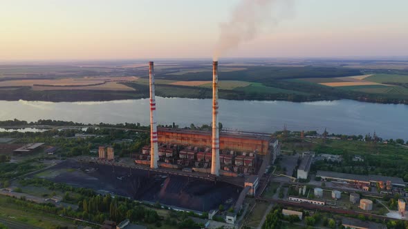 Industrial enterprise on nature background alt